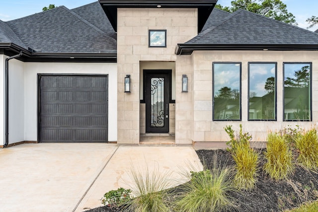 view of exterior entry with a garage