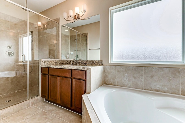 bathroom with vanity, tile patterned flooring, and separate shower and tub