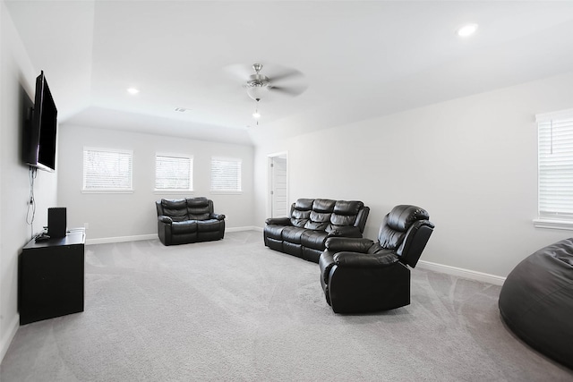 living room with light carpet and ceiling fan