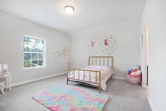 bedroom featuring vaulted ceiling and light colored carpet