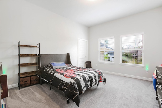 bedroom with light carpet