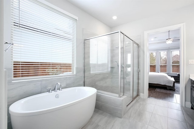 bathroom featuring tile patterned flooring and independent shower and bath