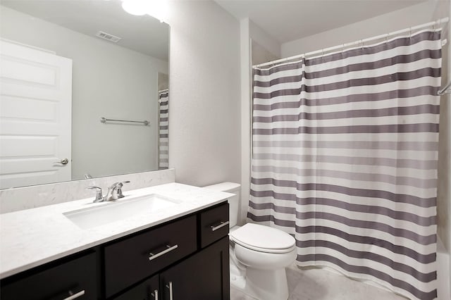 bathroom featuring vanity, toilet, and a shower with shower curtain