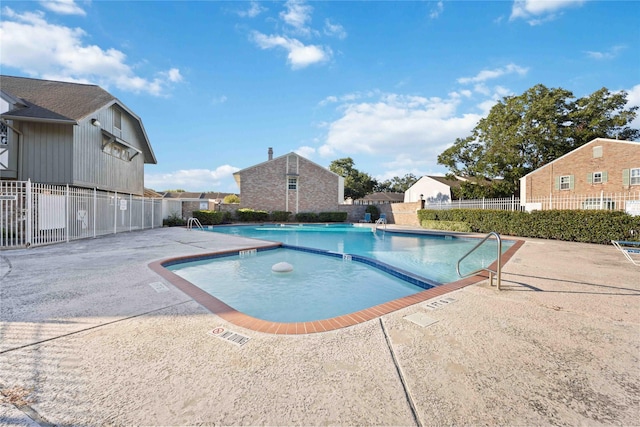 view of swimming pool featuring a patio