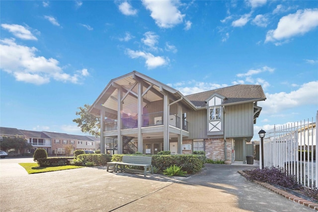 view of front of house featuring a balcony