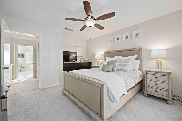 bedroom featuring light colored carpet and ceiling fan