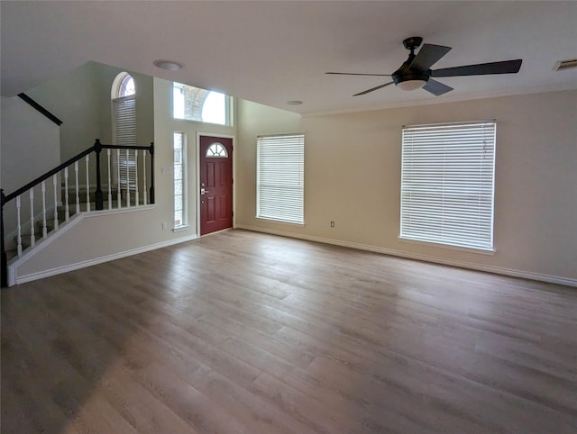 foyer featuring ceiling fan and wood-type flooring