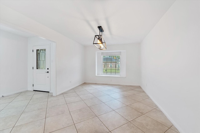 unfurnished dining area featuring light tile patterned flooring