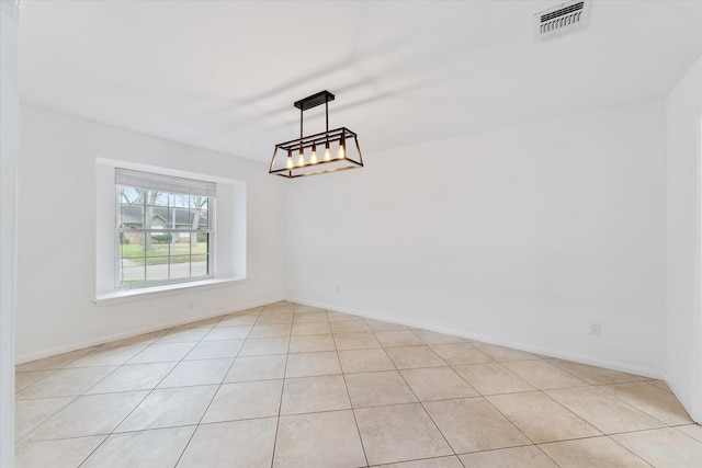 unfurnished dining area with a notable chandelier