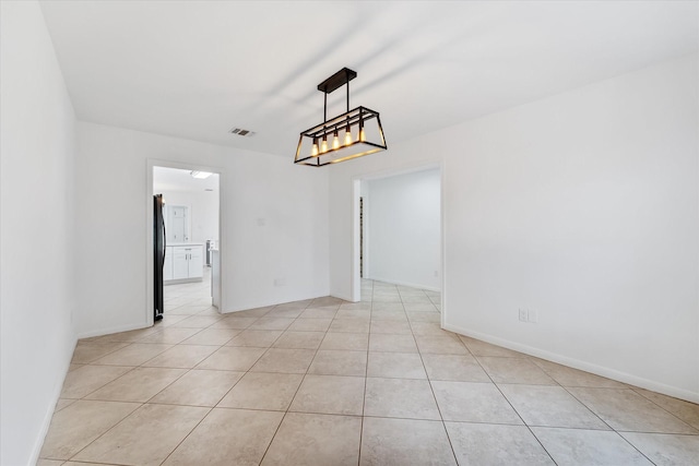 empty room with light tile patterned floors