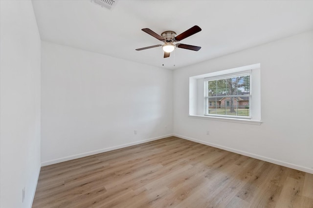 unfurnished room with ceiling fan and light hardwood / wood-style floors