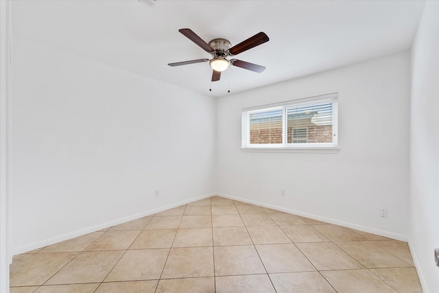 tiled empty room with ceiling fan