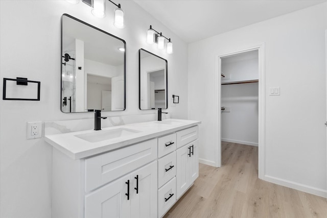 bathroom with wood-type flooring and vanity