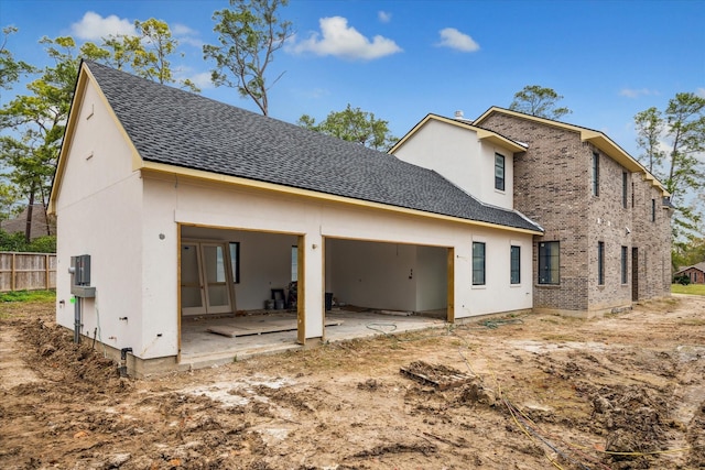 rear view of property featuring a patio area