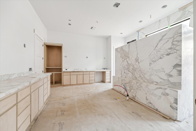 bathroom with vanity and a shower