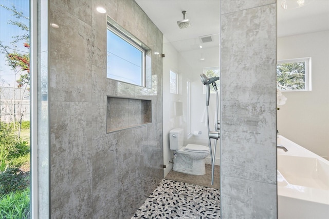 full bath with tile patterned floors, visible vents, toilet, and a walk in shower