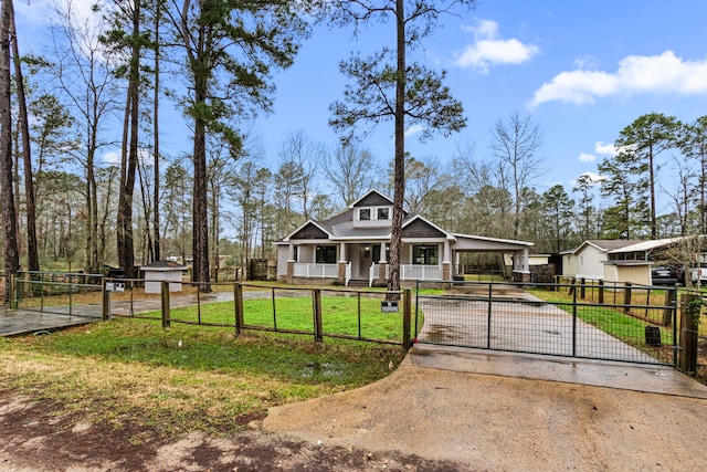 craftsman-style house featuring a front yard and covered porch