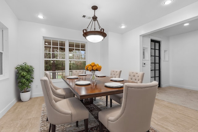 view of carpeted dining space