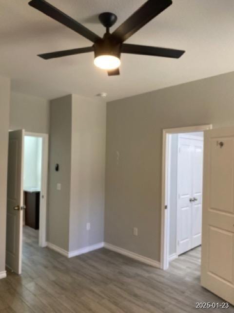 unfurnished room with hardwood / wood-style flooring and ceiling fan