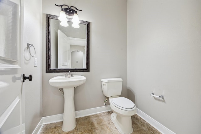 bathroom featuring tile patterned floors and toilet