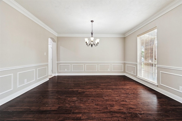 interior space featuring crown molding, dark wood-type flooring, and a notable chandelier