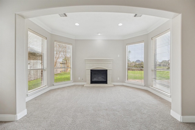 unfurnished living room with crown molding and light colored carpet