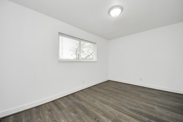 empty room with dark hardwood / wood-style floors