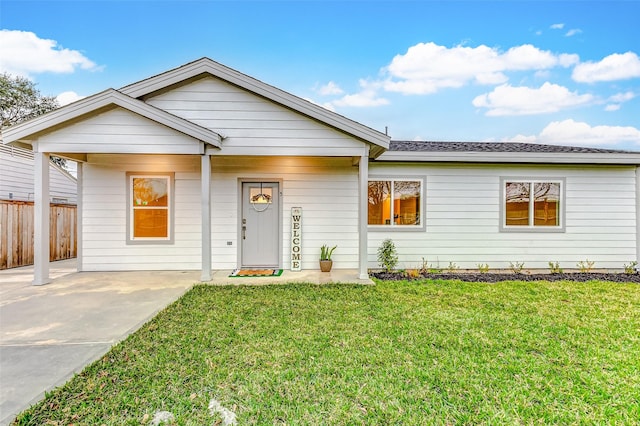 ranch-style house with a front lawn