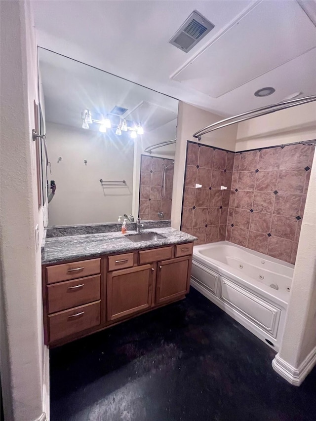 bathroom with vanity, visible vents, and a combined bath / shower with jetted tub