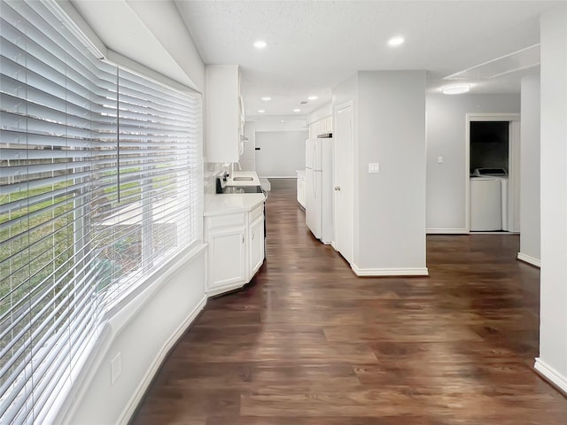 hallway with sink and dark hardwood / wood-style floors