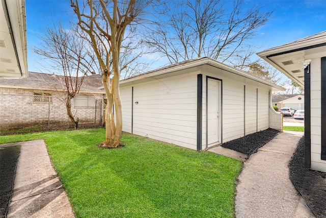 garage featuring a lawn