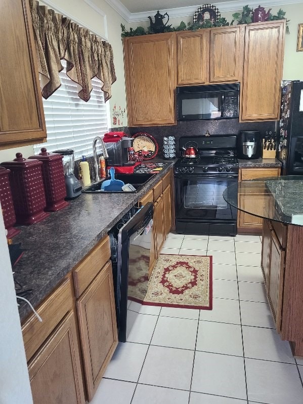 kitchen with black appliances, light tile patterned flooring, crown molding, and a sink