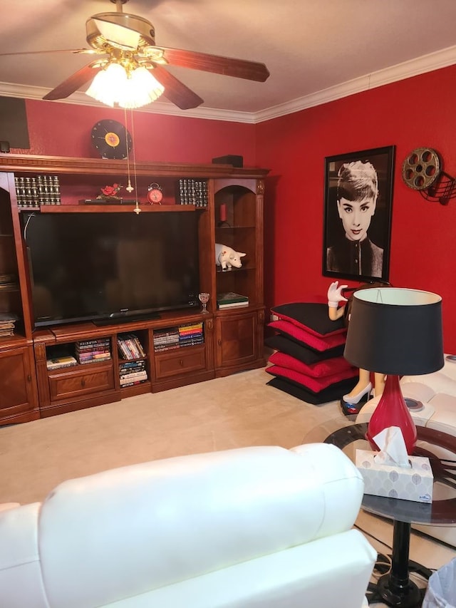 living area with carpet flooring, crown molding, and ceiling fan