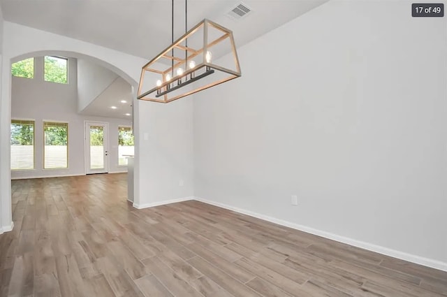 unfurnished dining area with wood-type flooring