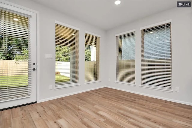 doorway with light hardwood / wood-style floors