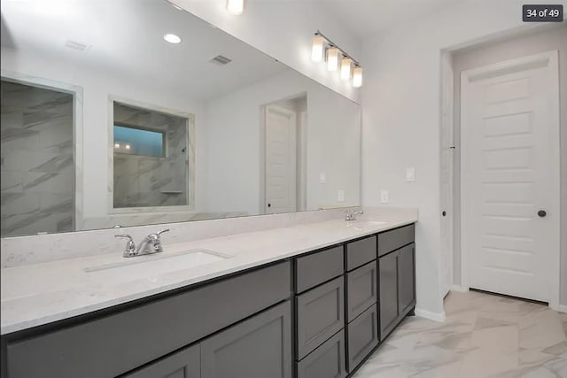 bathroom with vanity and a shower