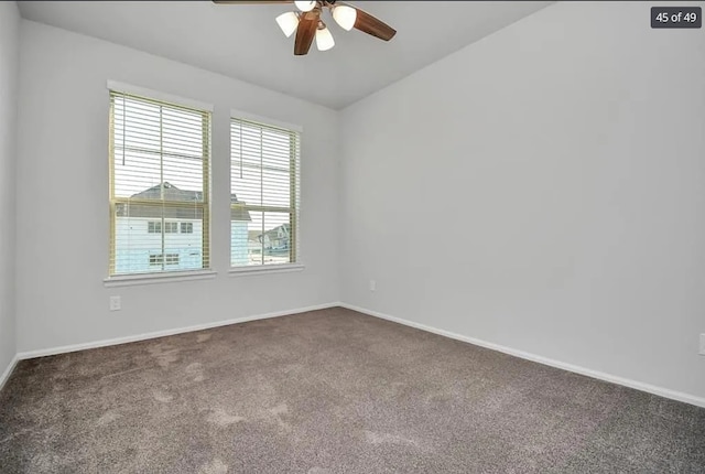 spare room with ceiling fan and carpet floors