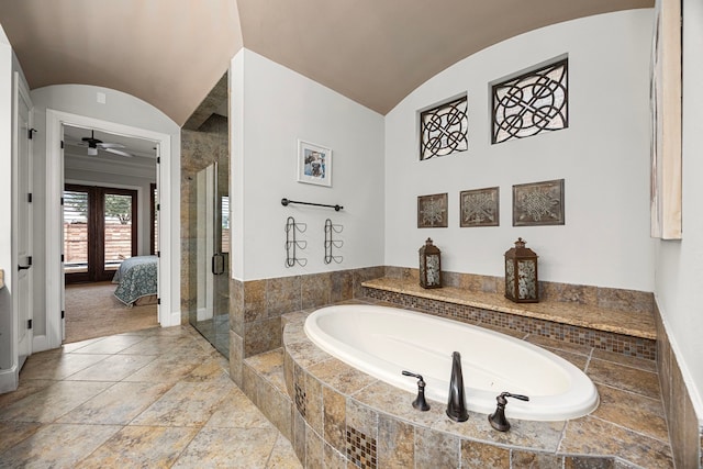 bathroom with plus walk in shower, lofted ceiling, ceiling fan, and french doors