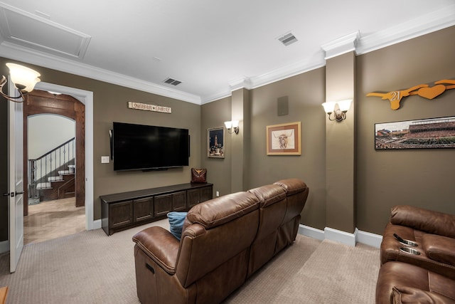 carpeted home theater featuring ornamental molding