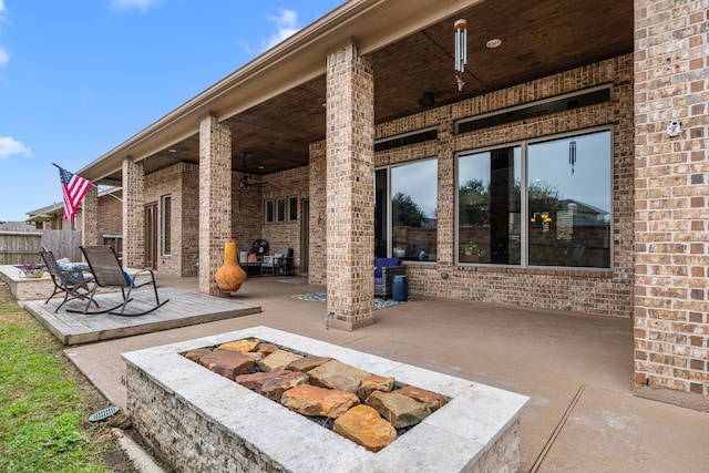 view of patio / terrace featuring an outdoor fire pit