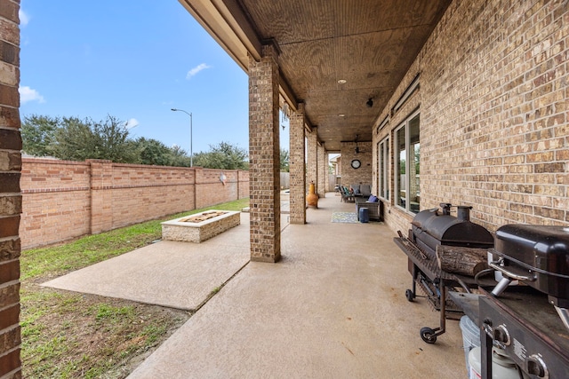 view of patio / terrace with a fire pit