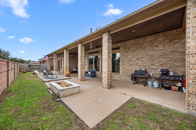 view of patio with a fire pit