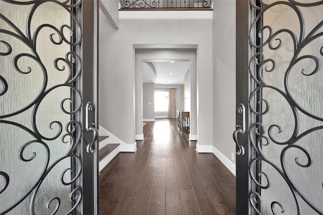 16434 Clear Water Cir, Montgomery, TX 77356 - foyer entrance with baseboards, dark wood-style flooring, and stairs