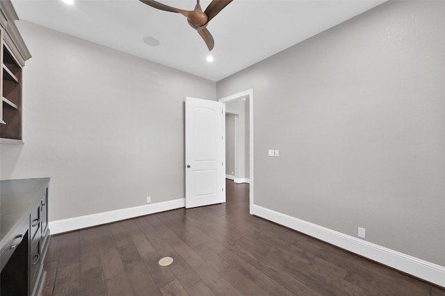 interior space with dark wood-style floors, recessed lighting, baseboards, and a ceiling fan