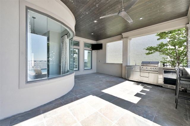 16434 Clear Water Cir, Montgomery, TX 77356 - view of patio / terrace featuring exterior kitchen, ceiling fan, and area for grilling