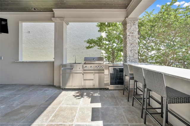 16434 Clear Water Cir, Montgomery, TX 77356 - view of patio / terrace featuring an outdoor kitchen and a grill