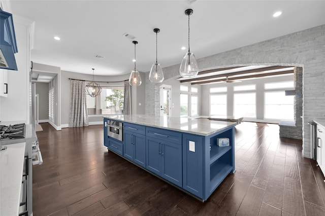 16434 Clear Water Cir, Montgomery, TX 77356 - kitchen featuring blue cabinetry, stainless steel appliances, open shelves, dark wood-style flooring, and recessed lighting