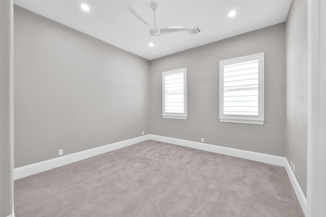 carpeted spare room with ceiling fan, visible vents, baseboards, and recessed lighting