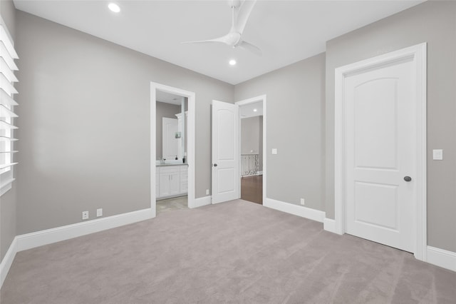 unfurnished bedroom featuring baseboards, connected bathroom, light colored carpet, ceiling fan, and recessed lighting