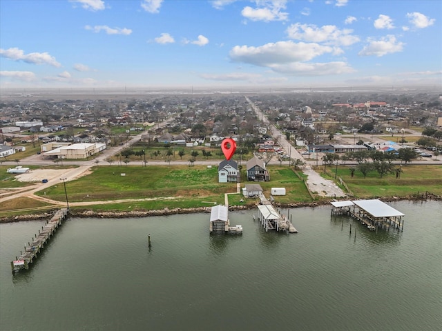 bird's eye view featuring a water view and a residential view